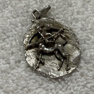 Silver and Rustic Series Sagittarius Brutalist Pendant. A rare find.